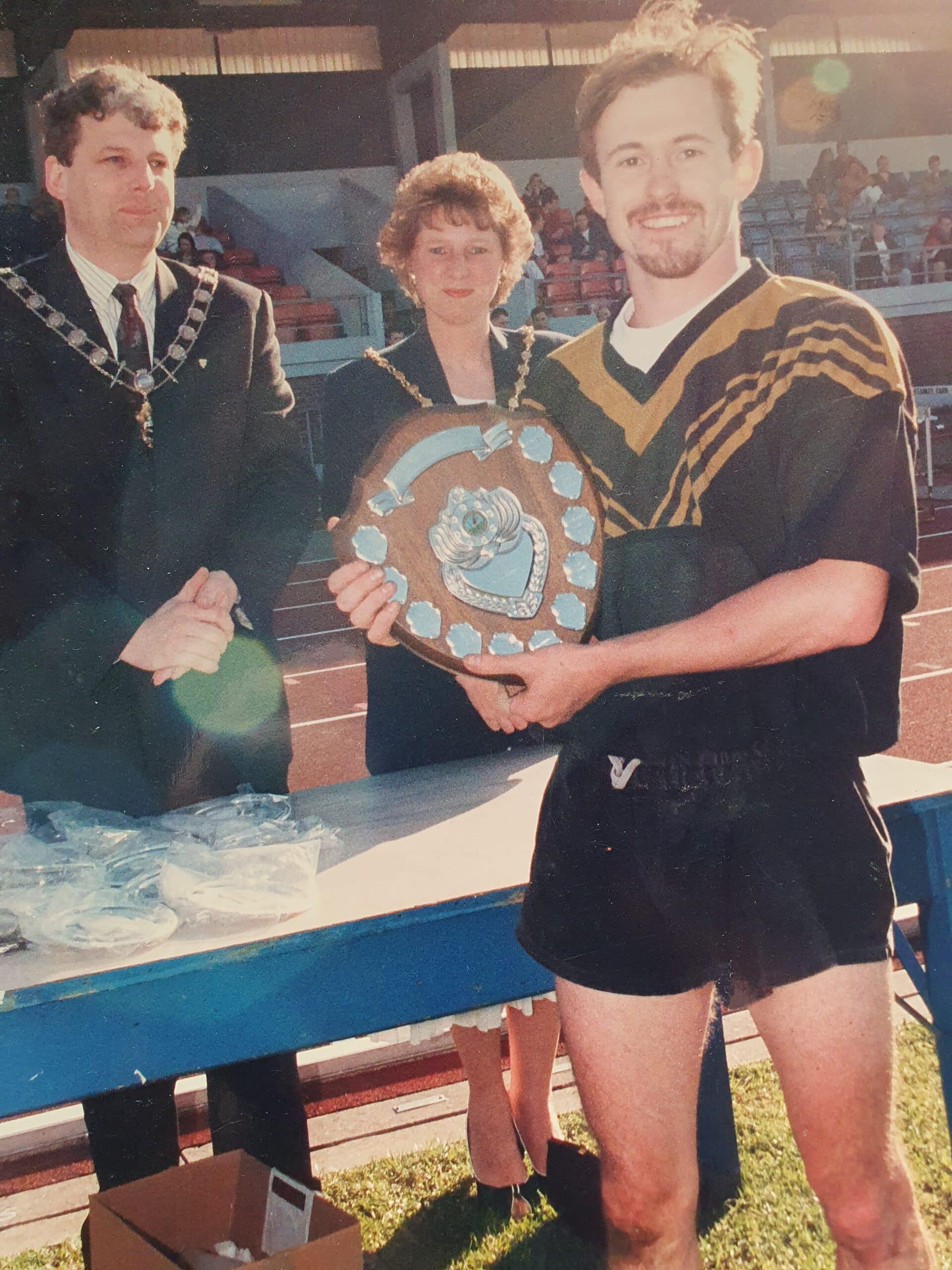 old photo of Captain Adam Olroyd accepting medal