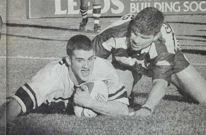 black and white photo of a tackle during Sharlston v Elland