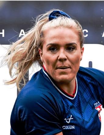 action headshot of Amy Hardcastle, who was long blonde hair which is up in a ponytail and wearing a navy top and looks to be mid-run