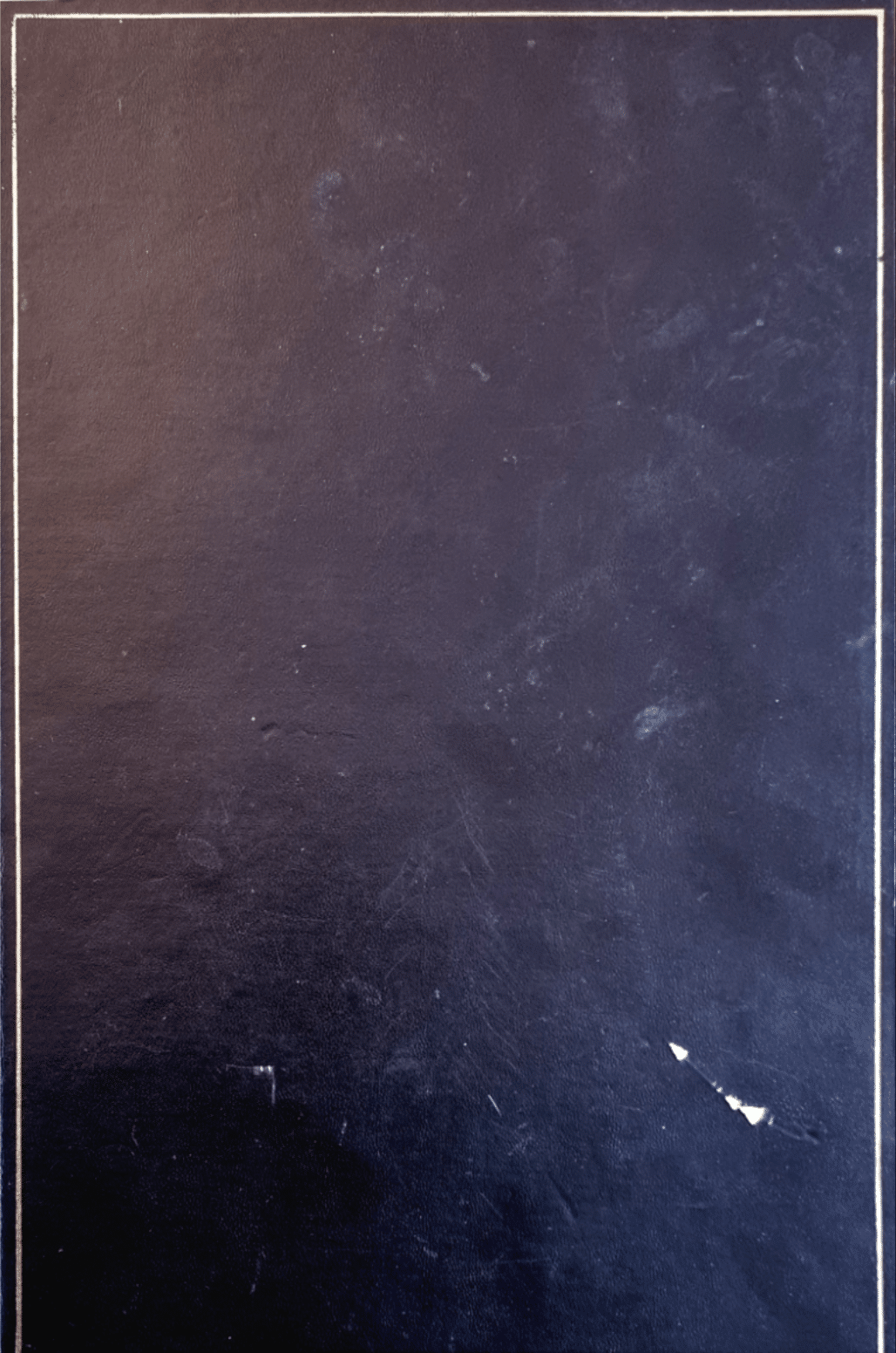 Scan of scrapbook front cover which is made of a blue leather-look material