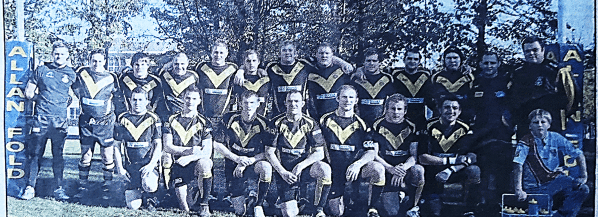 colour photo of the 2010 team in rows, wearing their kits