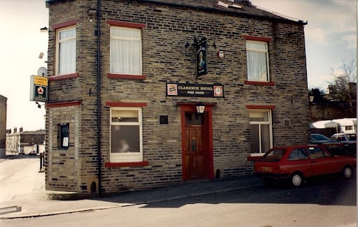 colour photo of the front of Clarence House pub, which has red painted features