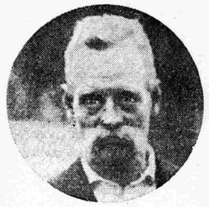 black and white photo of a person with a white mustache