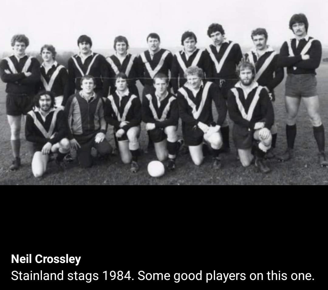 black and white team photo, players in two rows wearing kits
