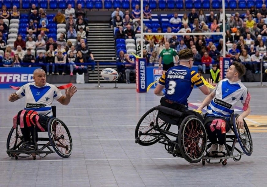 colour mid-match photo of Halifax wheelchair team on the court