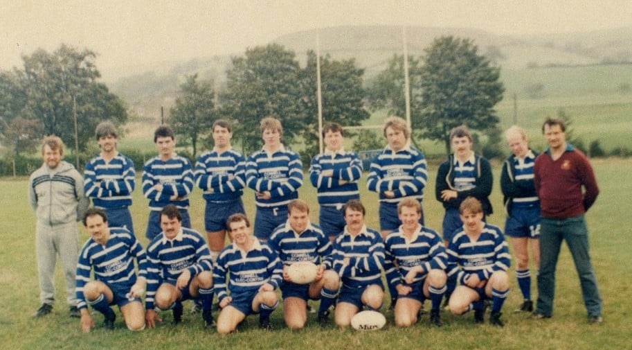 colour photo of Siddal team in the 1970s, wearing blue kits, in two rows, on the pitch