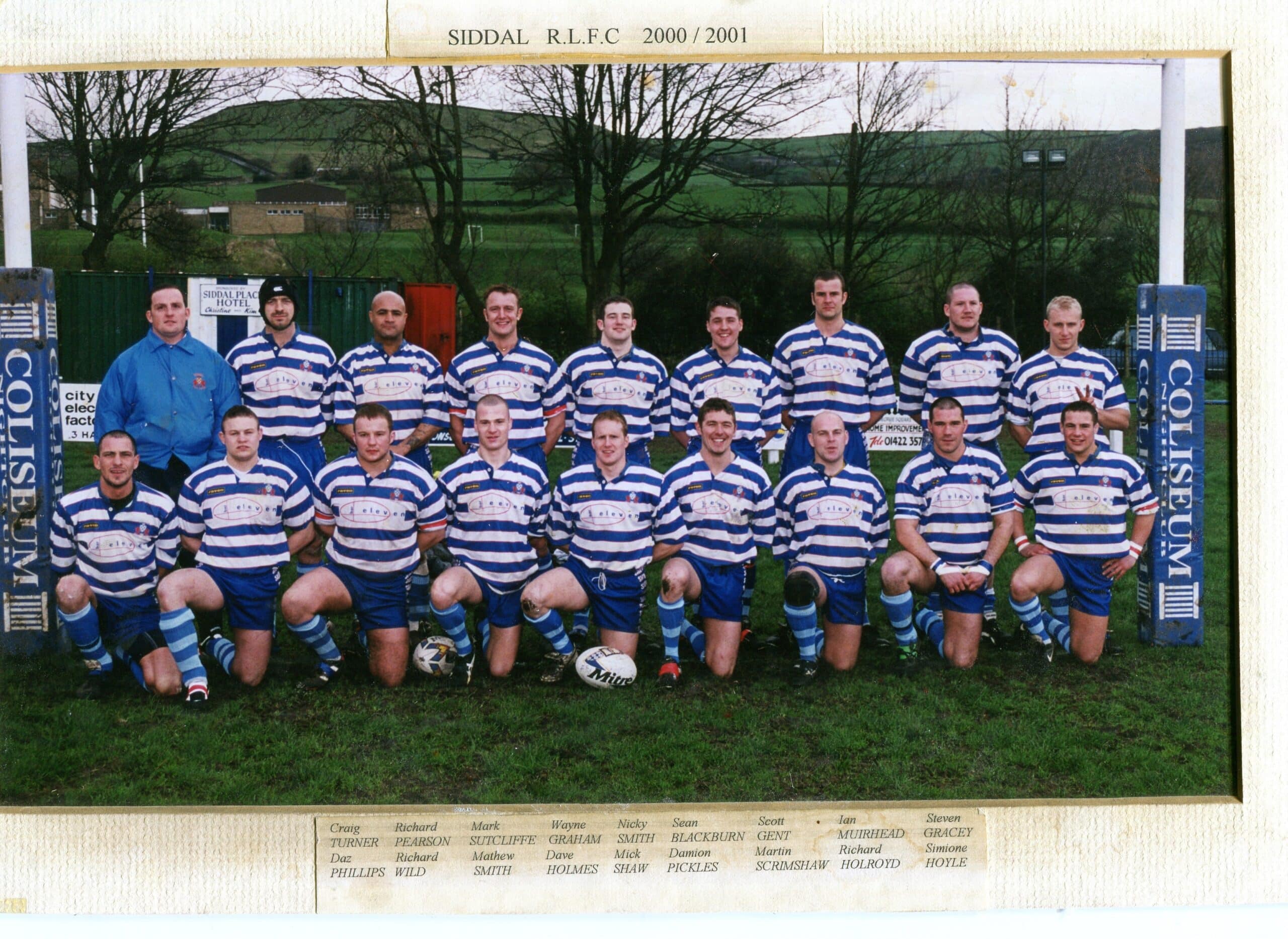 colour photo of Siddal team in 2001, players are in two rows on the pitch, wearing blue and white stripey kits