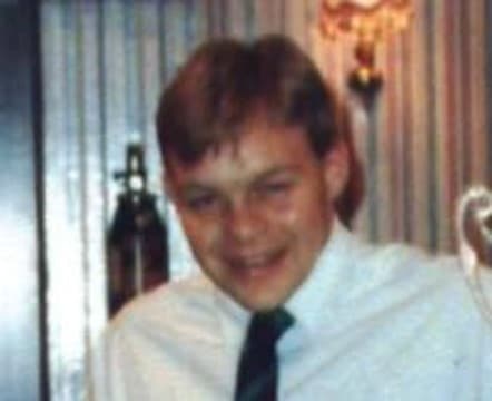 colour photo of Dave Stead who is smiling for the camera and has short light brown hair, wearing a white shirt and dark-coloured tie 