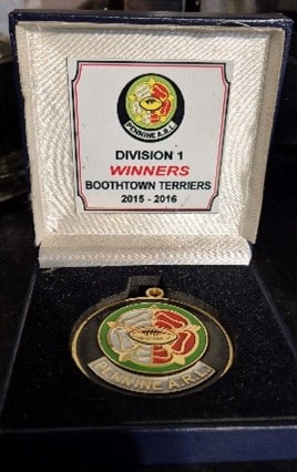 colour photo of a Division 1 Winners medal 2015-16