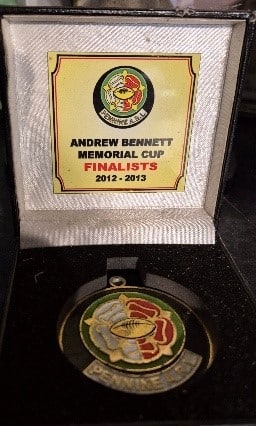 colour photo of a medal for Andre Bennett Memorial Cup Finalists 2012-23