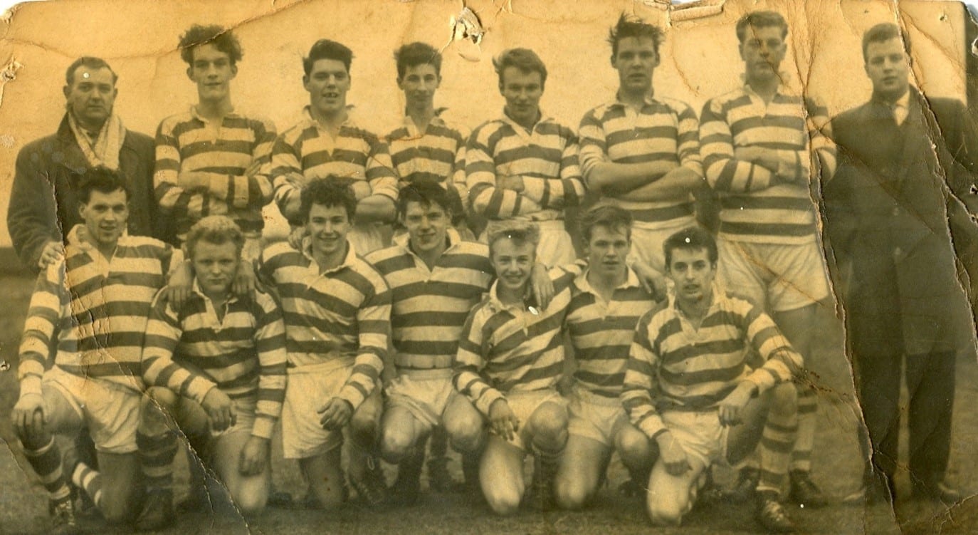 black and wide scan of Siddal team photo in the 1960s. Players are in two rows, wearing stripey kits, with a few people stood either side in dark suits