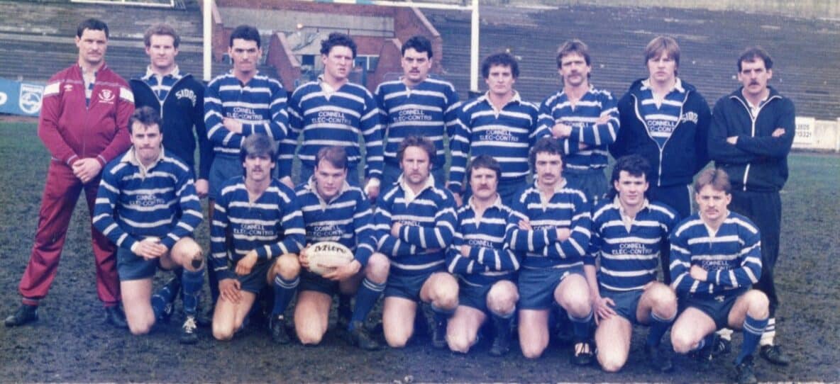 colour photo of Siddal team wearing stripey blue and white kits, standing on the pitch in the 1990s