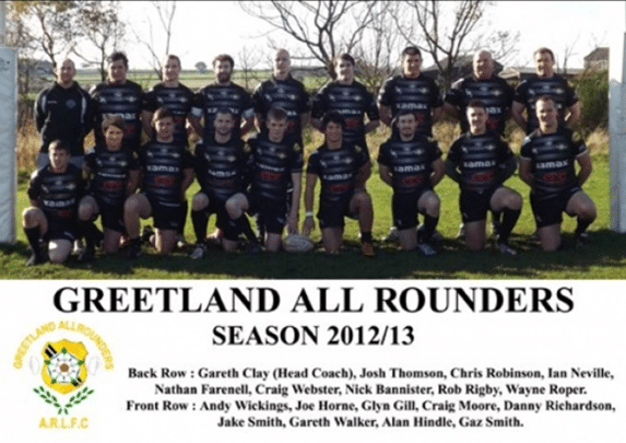 colour photo of the 2012-13 season team, in two rows, wearing their kits on the field, with their names printed below the photo 