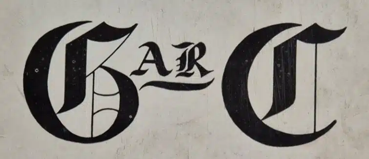 Illustrative old style lettering of the letters "GARC", in thick black lettering, against a light background