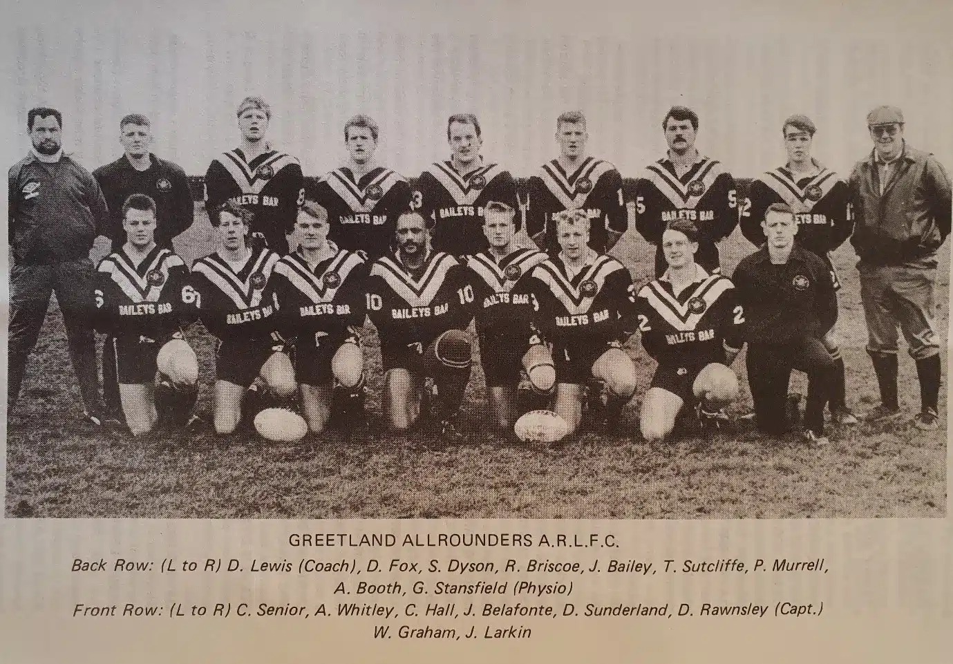 black and white team photo of 1980-1990 team. Wearing their kits and in two rows, with names printed below the photo